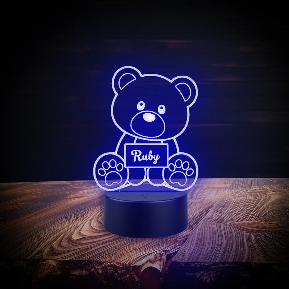Custom teddy bear lamp labeled Laurence, equipped with multicolour LED lights, powered by USB or batteries, and a controller.