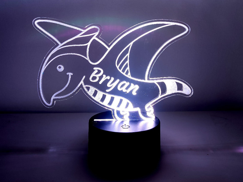 A personalized LED night lamp featuring a dinosaur, with multicolor light, USB or battery powered, and a controller.