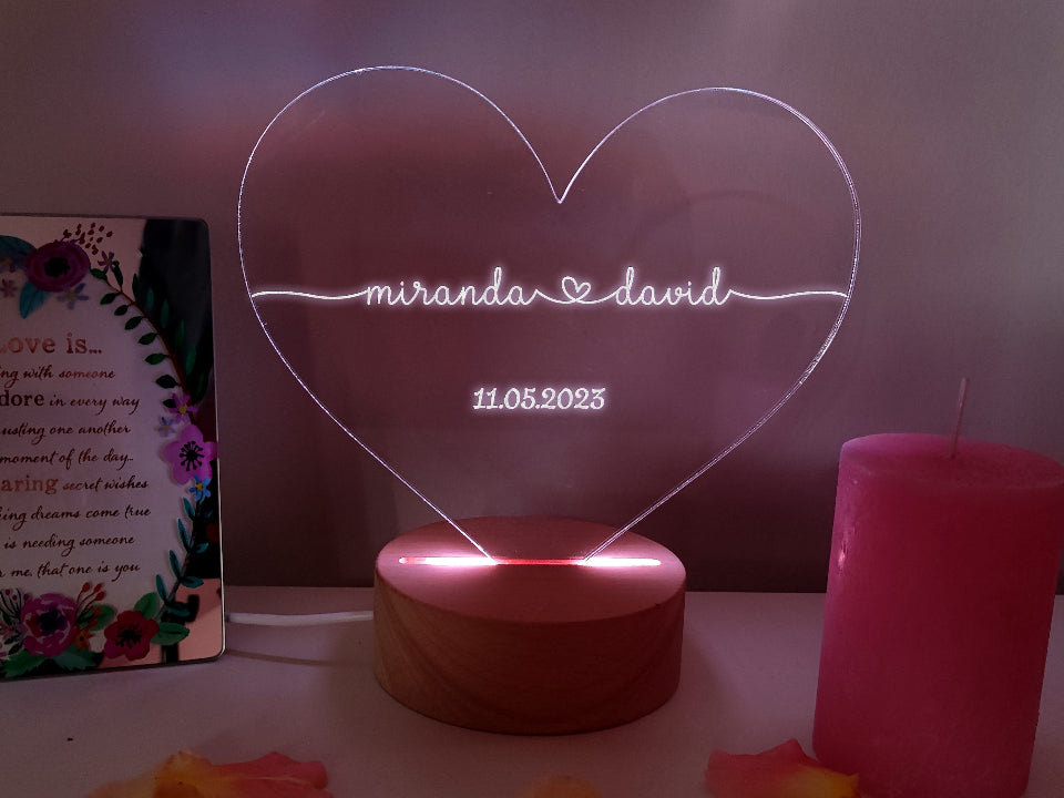 Heart-shaped night lamp with multicolour LED lights, remote control, and powered by USB cable or batteries.