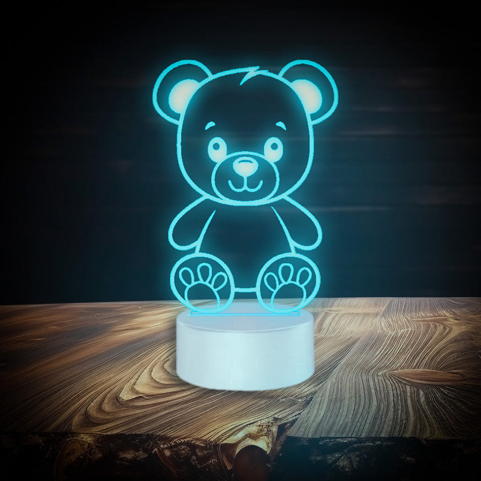 Personalized teddy bear lamp with multicolor LED light, featuring a name, powered by USB or batteries, includes a controller.