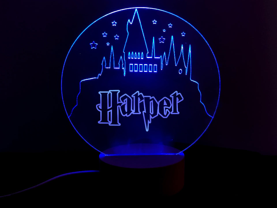 Multicolor LED lamp of Harry Potter castle, functioning as a night light, powered by USB or batteries, with a control feature.