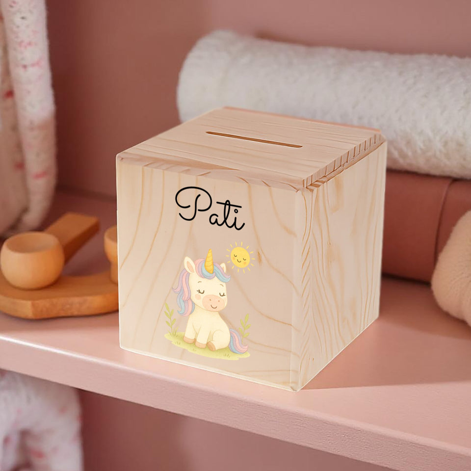 Wooden money box with a unicorn illustration and 'Pati' branding on a pink shelf.
