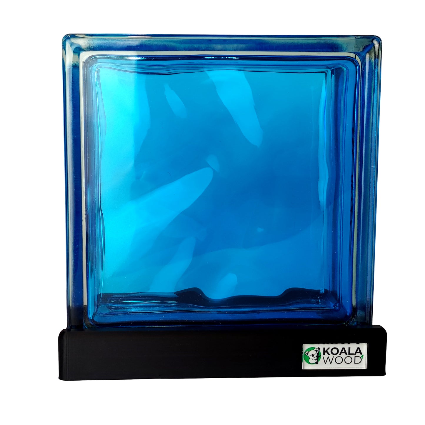 Blue glass block lamp on a black stand with Koala Wood logo.