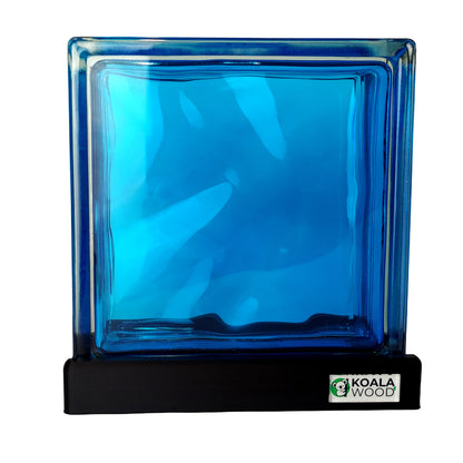 Blue glass block lamp on a black stand with Koala Wood logo.