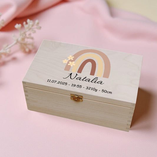 Wooden box with personalized details on a pink background