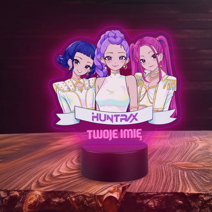 Decorative lamp with animated characters on a wooden surface