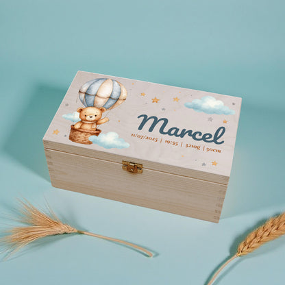 Wooden box with teddy bear and hot air balloon design on a light blue background