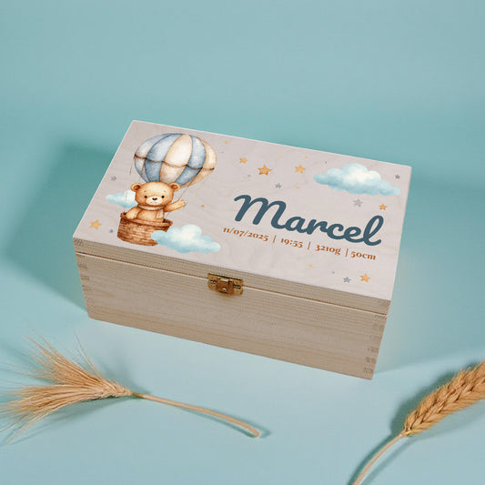 Wooden box with teddy bear and hot air balloon design on a light blue background