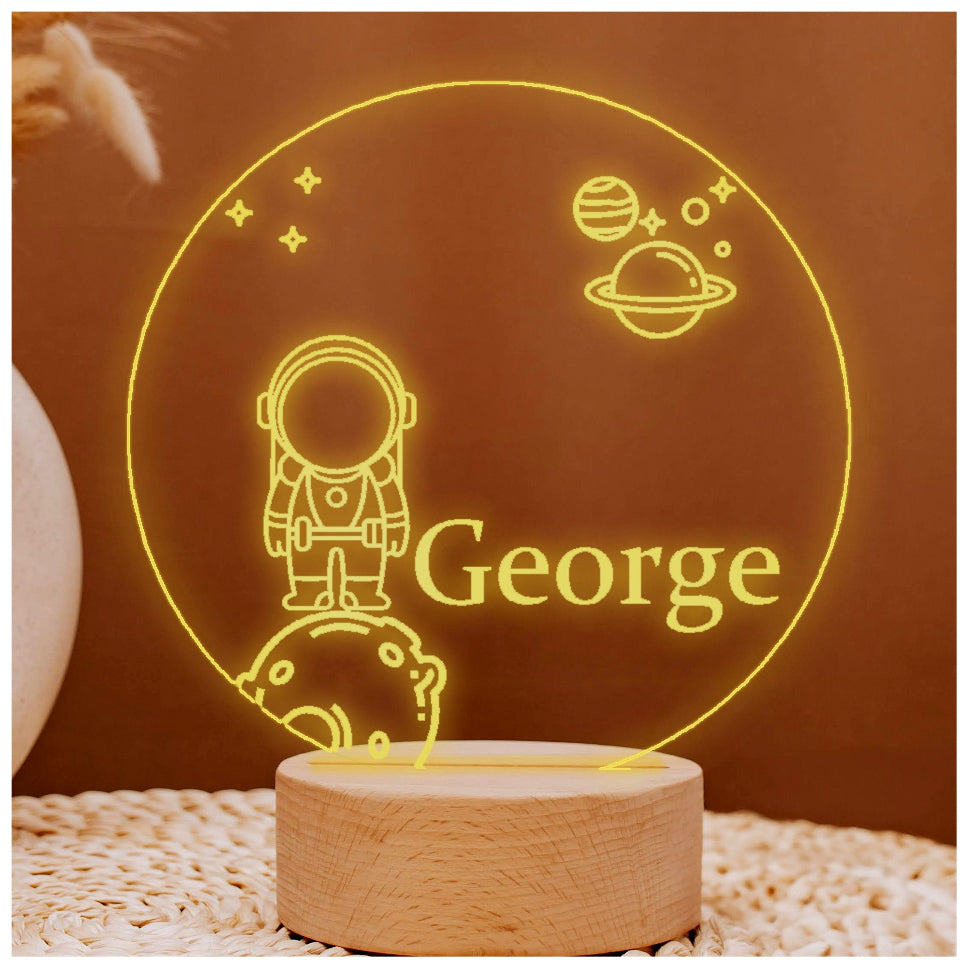 3D LED night light of an astronaut, multicolored, USB or battery-powered, with a controller for light settings.