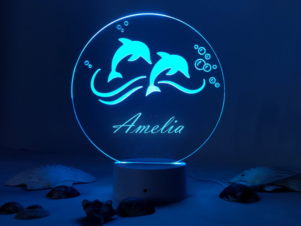 Personalized 3D LED dolphin night light, multicolor, USB or battery-powered, with a controller for easy operation.

