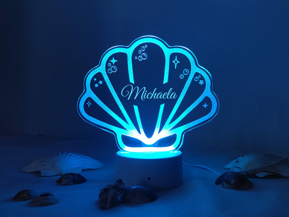 Multicolour LED shell night light, personalised, USB or battery powered, includes a controller for adjustable brightness.

