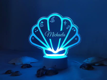 Multicolour LED shell night light, personalised, USB or battery powered, includes a controller for adjustable brightness.
